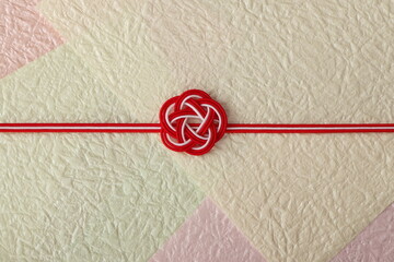 水引飾りの和風背景　梅結び　背景もみ紙使用