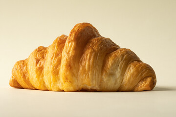 freshly baked croissants in a colored background, green, black, or neutral. with fresh flowers newspaper, cappuccino showing layers and crumbles and filling with berries