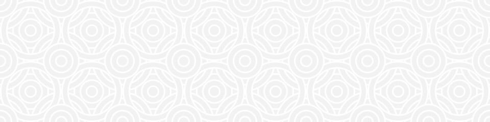 Seamless trend ornament of circles and arcs, geometric white shapes for textiles and wallpaper. Abstract panoramic pattern on a gray background for a New Year or wedding cover or card.