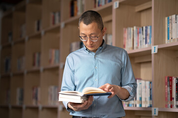 people reading book in library