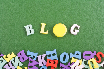 BLOG word on green background composed from colorful abc alphabet block wooden letters, copy space...
