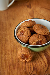 A bowl with pepas cookies on a table