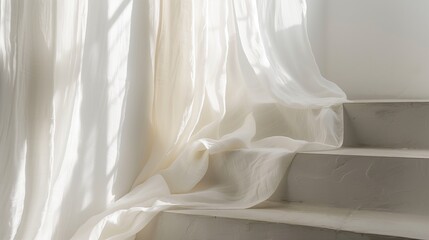 White linen fabric draped over a white staircase.