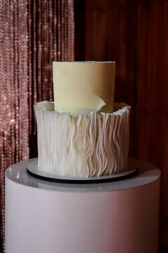 White wedding cake in reception.