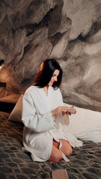A young woman tells fortunes with cards. A woman wants to know her destiny. The concept of magic and fortune telling. Vertical video