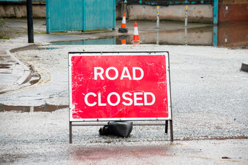 Road closed due to floods- danger sign warning the driving  public of floods ahead after heavy rain...