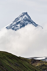 Mountain landscape of Kamchatka: Kamen Volcano in clouds