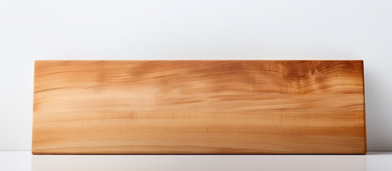 Fototapeta premium A cutting board with a clean white background providing ample copy space for your image