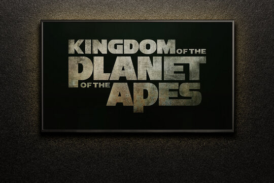 Kingdom of the Planet of the Apes trailer or movie on TV screen. TV on black textured wall.