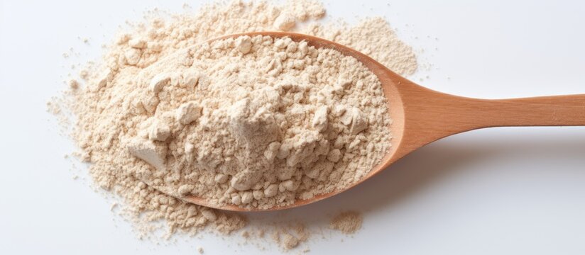 A sports nutrition supplement whey protein isolate captured in a copy space image on a white background ready to be measured with a spoon