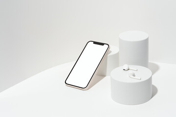 White blank screen smart phone mockup, template on geometric pedestal