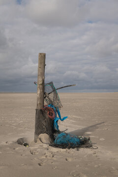 trash from the sea and waste from beachcombing on beach near ocean