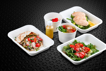 A variety of healthy and delicious meal options packed in eco-friendly containers for a convenient and sustainable way to eat.