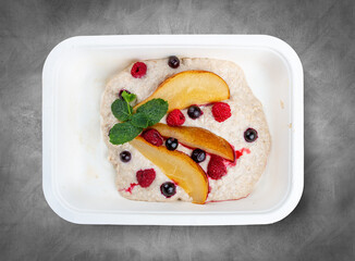 Stewed pear with curd mousse. Healthy food. Takeaway food. Top view, on a gray background.