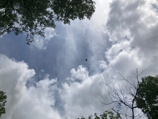 clouds and fighter jet in the sky