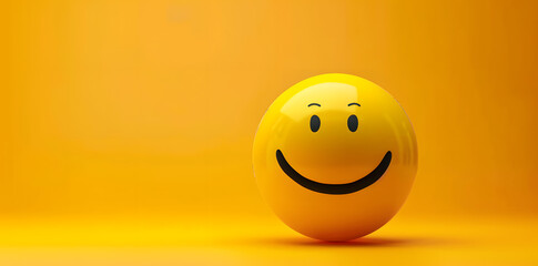 Fototapeta premium Happy yellow smile emoji isolated on yellow background with copyspace for text