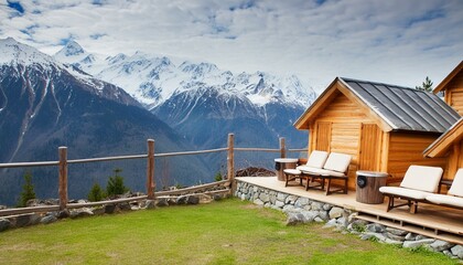 Wooden mountains cabin built on a rock foundation with a panoramic view outdoors seating area
