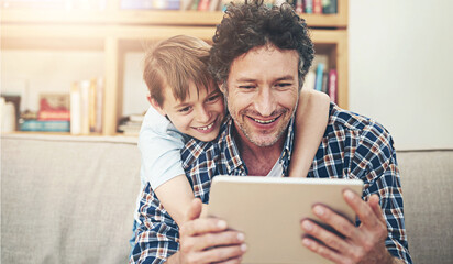 Happy, tablet and father with child in home for watching movies, cartoons and online entertainment....