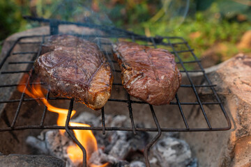 Sirloin beef grill on fire outdoor cooking