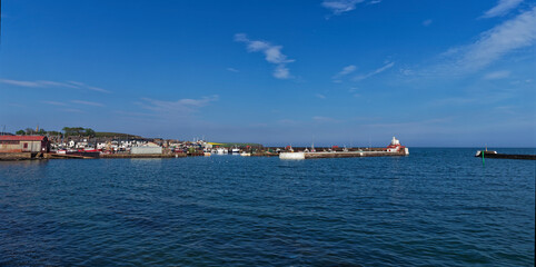 A view of Arbroath Harbour with the Signal Lighthouse and West Breakwater leading to the Tidal...