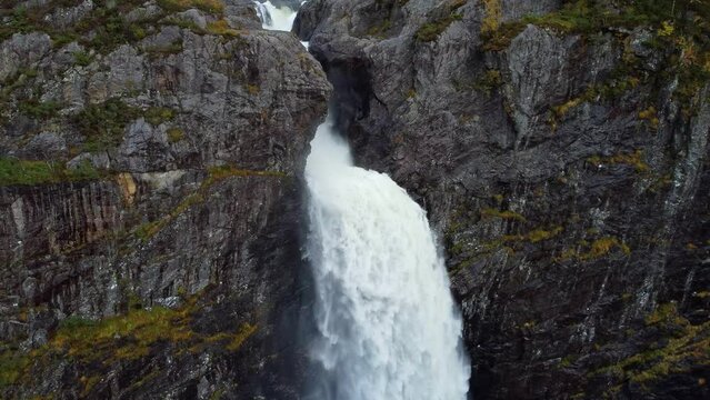 Breathtaking aerial view of the huge waterfall and the valley that surrounds it. Bird's eye view. Norway, Manafossen.