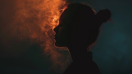 Fototapeta premium Dramatic Silhouette Of A Woman In Red And Blue Smoke
