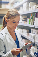 Pharmacy, woman or pharmacist with tablet for research or checking medical prescription on shelf....