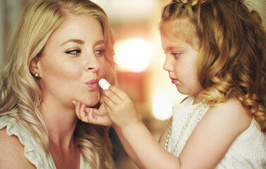 Lipstick, mother or child play with makeup in home for beauty, care or family bonding together....