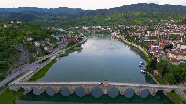 Beautiful 4k aerial drone video of Mehmed Pasa Sokolovic bridge in town Visegrad, landmark from 16th century, Visegrad, Republic of Serbia, Bosnia and Hercegovina 11.05.2024