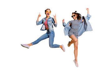 Full legs body size two attractive music lover leisure lifestyle cool lady isolated on yellow vivid background in glasses spectacles dance dancer on concert raised fists up give heavy metal gesture