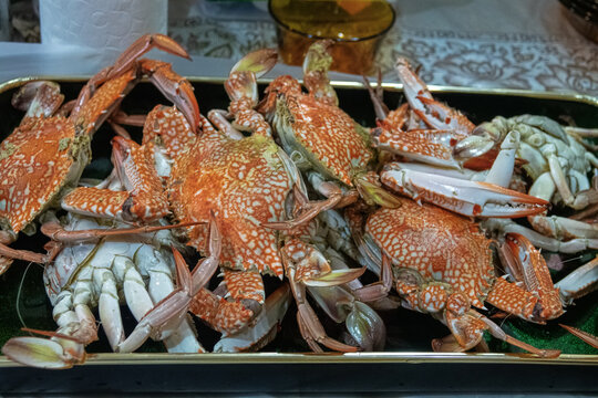 Bandar Abbas, Iran - January 9, 2023: Crab dish (boiled crabs) and tortillas in an Iranian restaurant
