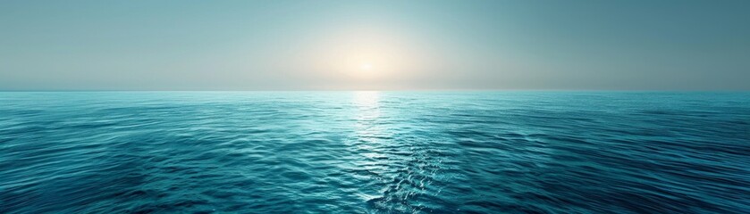 Obraz premium The image shows a beautiful seascape with a bright sun rising over the horizon and shimmering on the surface of the water.