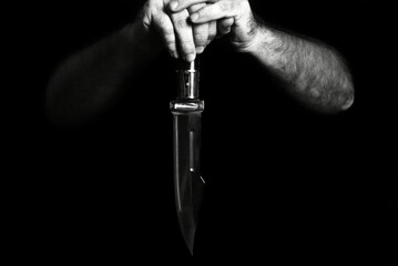 man wielding make expressively holding cutting metal blade black and white photo art expression