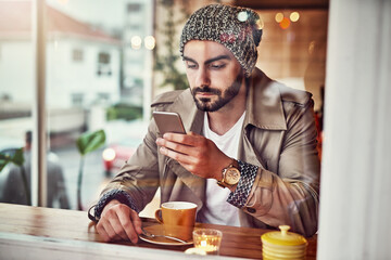 Smartphone, coffee and man in cafe for social media, communication or networking. Online, relax and male person with hot beverage by table for browsing internet, trending update or lunch break