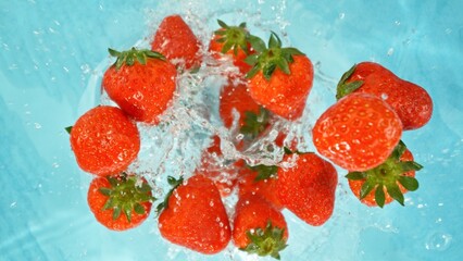 Freeze Motion of Strawberries Falling into Water, Splashing.