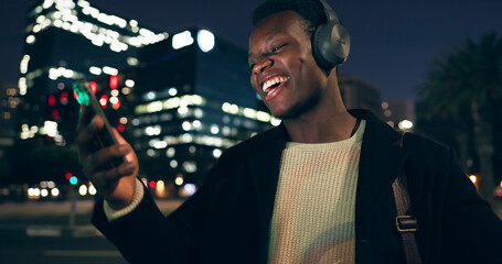 Black man, headphones and music with city, night and audio livestream or subscription. African guy,...