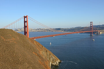 Fototapeta premium View of Golden Gate Bridge from Marin Headlands in early evening. San Francisco, California