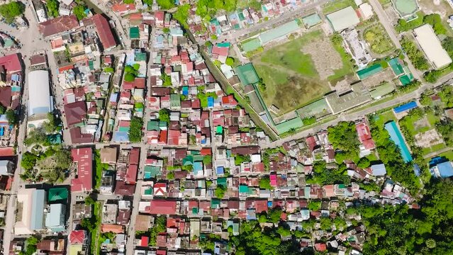 Flying over the houses and buildings in municipality in Romblon Island, Romblon, Philippines.