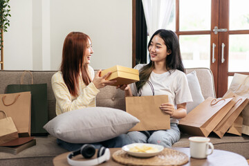 Young woman lesbian is excited face while receive present from girlfriend and spending time to relaxation