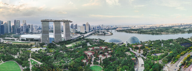 Marina Bay in Singapore features the iconic Marina Bay Sands, Gardens by the Bay, Helix Bridge, and...