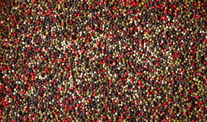 Multicolored Peppercorns background. Peppercorns background, texture. Pepper mix. Colorful Pepper mix. Top view