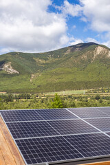 solar panels on the roof of the house in the mountains, solar home energy