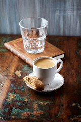 Cup of coffee and Cantuccini (Italian cookie) on dark wooden background. Copy space.	
