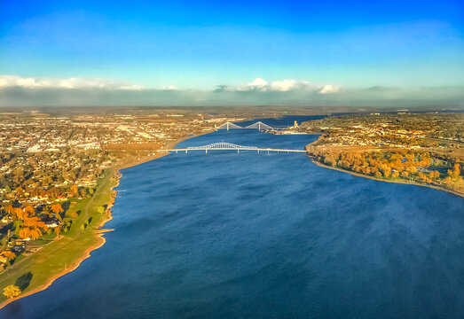 Aerial view of the Columbia River flowing under bridges connecting the Tri-Cities of Pasco, Kennewick, and Richland in Washington State