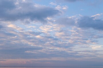 Clouds at sunset with birds flying around