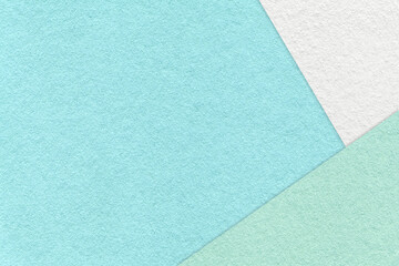 Texture of craft light blue color paper background with white, green and mint border. Vintage...