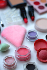 Naklejka premium Various colorful beauty products on white background. Selective focus.