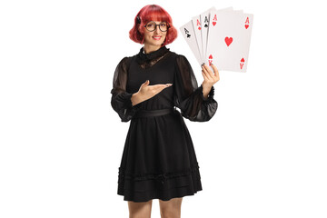 Female magician with cards showing four aces