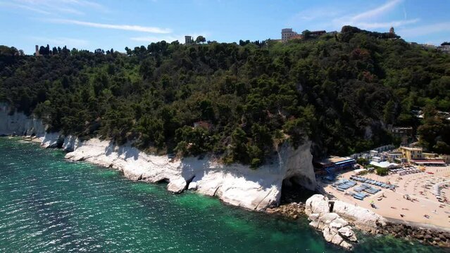 Italy summer holidays, best scenic sea landscape and beaches of Riviera del Conero- natural park near Ancona. Marche region. View of picturesque beach Spiaggia del Frate. 4k hd aerial drone video