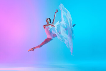 Ballet dancer performs jumping split in motion with flowing white cloth in neon light against vivid gradient background. Concept of art, movement, classical and modern fusion, beauty and fashion. Ad © master1305